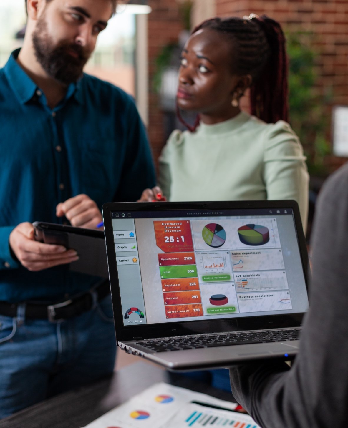 multiracial-businesspeople-analysing-company-turno-2025-02-19-15-42-51-utc